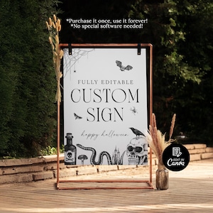 May include: A framed sign with a copper-colored frame, featuring a white background with black Halloween-themed illustrations. The sign reads "FULLY EDITABLE CUSTOM SIGN" with "happy halloween" below. Includes a bat, spider, skull, and snake.