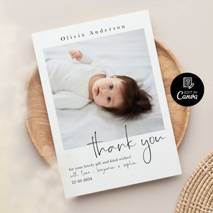 May include: A white thank you card with a photo of a baby girl lying on a white blanket. The text on the card reads "thank you for your lovely gift and kind wishes! with love - beryanin & sophia 22-01-2024".
