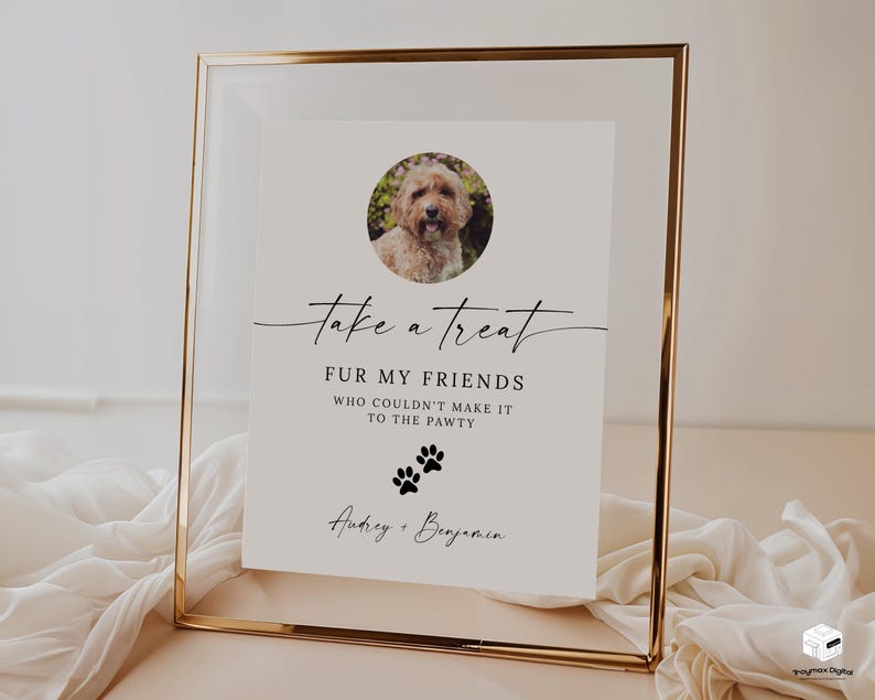 May include: A white sign with black text and a photo of a dog in a gold frame. The sign reads "take a treat FUR MY FRIENDS WHO COULDN'T MAKE IT TO THE PAWTY Audrey + Benjamin".