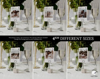 May include: Wedding table number cards with photos, displayed in champagne flutes. Each card is held by a silver metal clip and rests on a small, square, light grey block. The text on the cards reads "Table no. 1, 2, 3, 4, 5, 6". The image also includes the text "4x20 DIFFERENT SIZES".