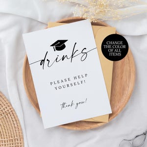 May include: A white graduation party sign with the word "drinks" in elegant script, a graduation cap icon, and the text "Please help yourself!" and "Thank you!". A black circle with the text "Change the color of all items" is also visible.