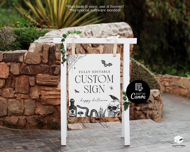 May include: A white wooden sign with a Halloween theme. The sign reads "CUSTOM SIGN" with decorative illustrations of a bat, spider, skull, and snake. The sign is decorated with greenery and is set outdoors.