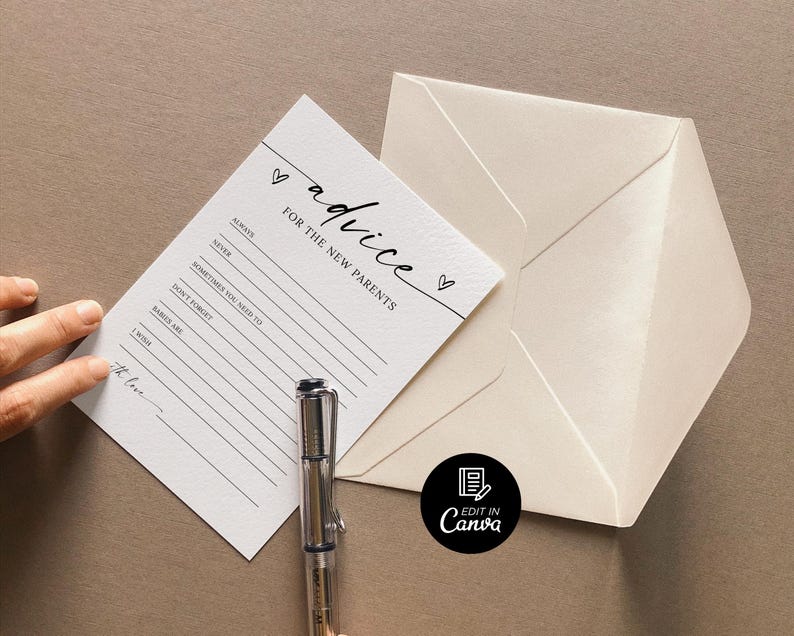 May include: A white card with black text that reads "advice for the new parents" with a heart symbol. The card has lines for writing advice. A pen is lying on top of the card.