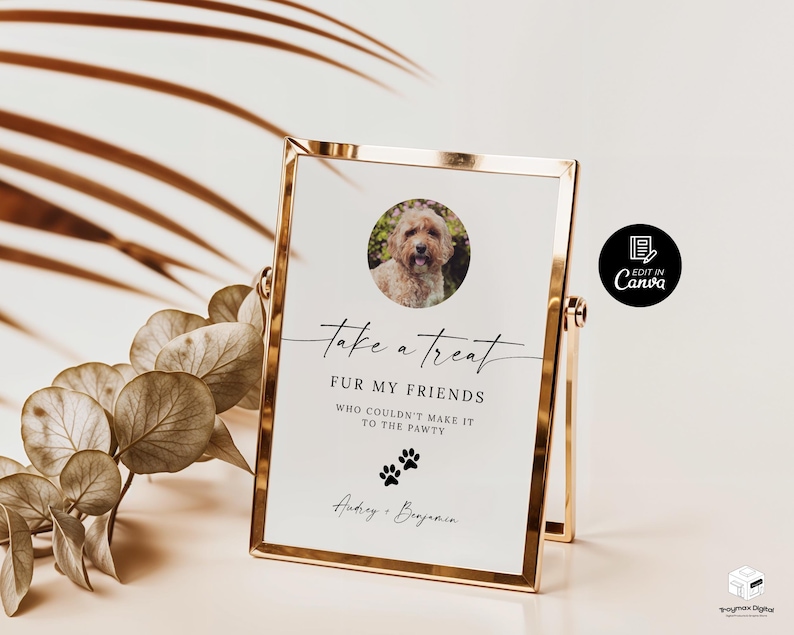 May include: A white sign with black text that reads "take a treat FUR MY FRIENDS WHO COULDN'T MAKE IT TO THE PAWTY" with a paw print graphic and the names "Audrey & Benjamin". A photo of a dog is in the top left corner of the sign. The sign is in a gold frame.