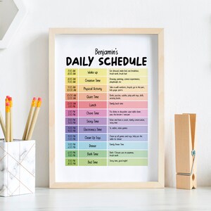 May include: A colorful daily schedule chart for a child named Benjamin. The chart lists activities like wake up, creative time, physical activity, quiet time, lunch, chore time, story time, electronics time, clean up toys, dinner, bath time, and bed time. Each activity is assigned a specific time slot throughout the day.