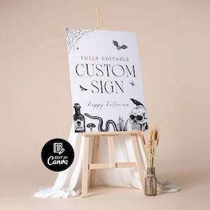 May include: A white sign on a wooden easel with Halloween-themed illustrations. The sign reads "FULLY EDITABLE CUSTOM SIGN" and "happy halloween". The illustrations include a spiderweb, bat, spider, poison bottle, snake, skull, and raven.