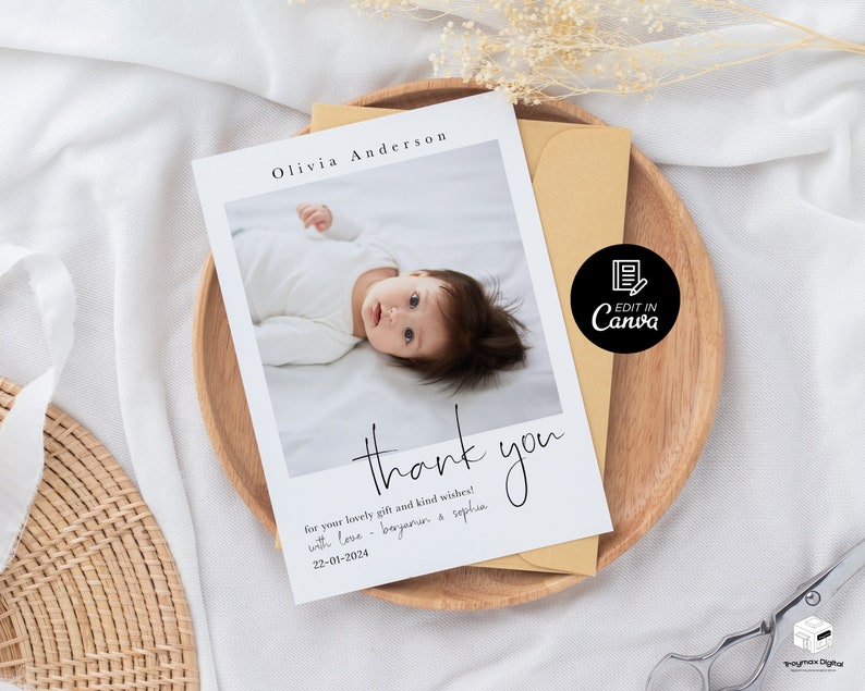 May include: A white thank you card with a photo of a baby in a white onesie. The card has black text that says "Olivia Anderson" and "thank you" with a handwritten style font. The text also says "for your lovely gift and kind wishes! with love - beyanen & sophia 22-01-2024".