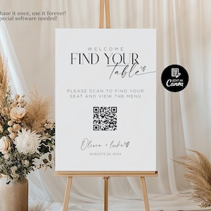 Könnte beinhalten: Ein weißes Schild mit schwarzem Text, der "Willkommen Finden Sie Ihren Tisch" mit einem Herzsymbol lautet. Unter dem Text befindet sich ein QR-Code und der Text "Bitte scannen Sie, um Ihren Platz zu finden und das Menü einzusehen". Unter dem QR-Code befindet sich der Text "Olivia + Luke" mit einem Herzsymbol und dem Datum "24. August 20XX".