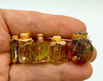 Miniature glass jars with olive oil, spices, and herbs for your dollhouse kitchen