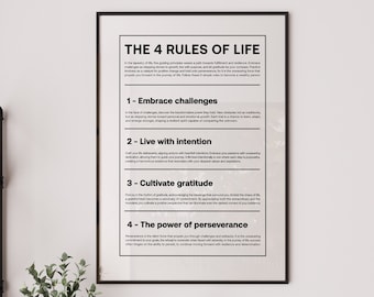 May include: A framed print with the text "THE 4 RULES OF LIFE" in a black frame. The print lists four rules: Embrace challenges, Live with intention, Cultivate gratitude, and The power of perseverance. The print is displayed on a shelf with decorative items.