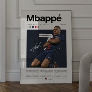 May include: A poster featuring a photo of Kylian Mbapp&eacute;, a French professional soccer player, wearing a blue and white soccer uniform. The poster has the text "Mbapp&eacute;" in large black letters at the top and "Paris Saint-Germain F.C." in smaller black letters below. The poster also includes a rating of 91 out of 100 stars.