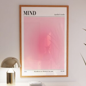 May include: A framed art print with a gradient pink and white background. The word "MIND" is at the top, with "Apolioh Studio" to the right. The text "All problems are illusions of the mind" is at the bottom, with "AURA" and "NO. 002" on either side.