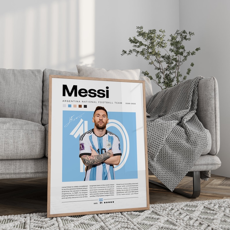 May include: A poster featuring a photo of Lionel Messi in his Argentina national football team jersey. The poster has a blue background with the text "Messi" in black and "Argentina National Football Team 2005-2023" in white. The poster also includes a rating of 91 stars and a quote about Messi's skills.