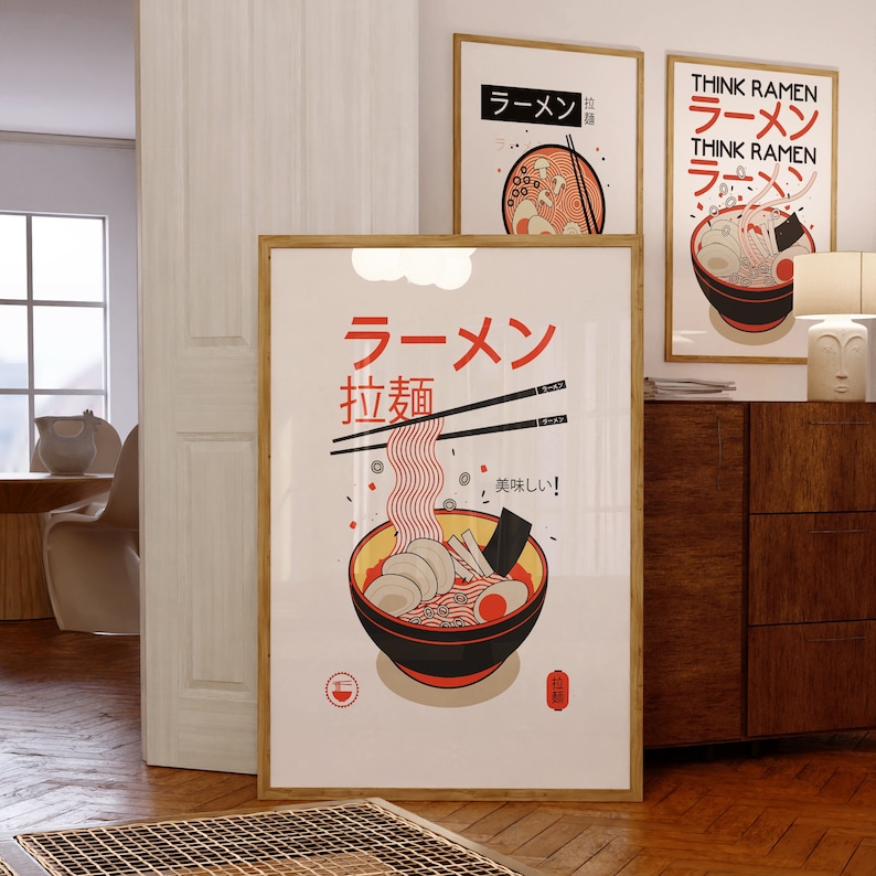 Puede incluir: Un p&oacute;ster enmarcado con una ilustraci&oacute;n roja y blanca de un taz&oacute;n de fideos ramen. El p&oacute;ster tiene el texto japon&eacute;s "Ramen" y "Fideos" en negro. El texto "&iexcl;Delicioso!" est&aacute; escrito en japon&eacute;s en la esquina inferior derecha del p&oacute;ster.