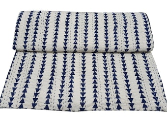 May include: A white cotton kantha quilt with a navy blue chevron pattern. The quilt is hand-stitched and has a traditional Indian design.