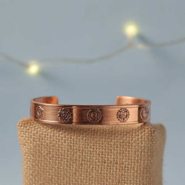 Isha's Chakra copper cuff. Crafted of pure copper with the mantras of the seven chakras engraved across its length