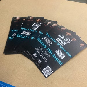 May include: Black and white flyers advertising a music event called "Lunar Hijack" featuring the text "Space & Time" EP Release Show. The event will take place on Saturday, August 19th at Asylum 2 in Birmingham. A QR code is included on the flyer.