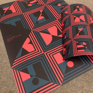 May include: A black and red geometric pattern wrapping paper with the text "HEATHER Happy Birthday Hope you have a great day Love L&Y xx".