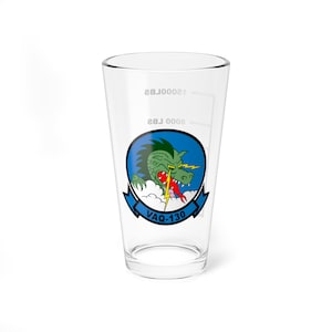 May include: A clear glass pint glass with a blue circle graphic featuring a green dragon with red lightning bolts and the text "VAQ-130".