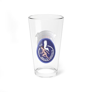 May include: Clear pint glass with a blue, white, and red graphic. The graphic features a running nude woman with a halo, a silhouette, and the words "HELL'S ANGELS" in a circular design.