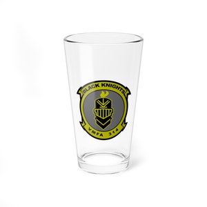 May include: A clear glass pint glass with a yellow and black logo that says "Black Knights" and "VMFA 314".