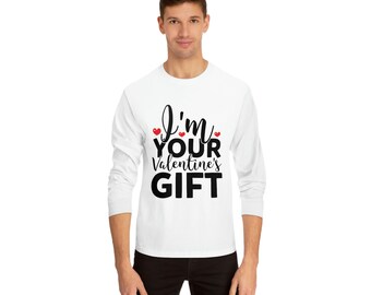 May include: White long-sleeve shirt with the text "I'm your Valentine's GIFT" in black script and bold font. The design includes three small red hearts. The shirt is a casual style.