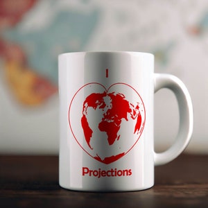 May include: White ceramic mug with a red heart design featuring a world map. The mug has the text "I ♥ Projections" printed on it.