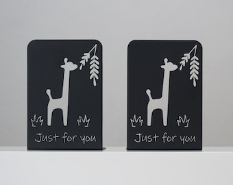 May include: Two black metal bookends with a white giraffe design and the text "Just for you".
