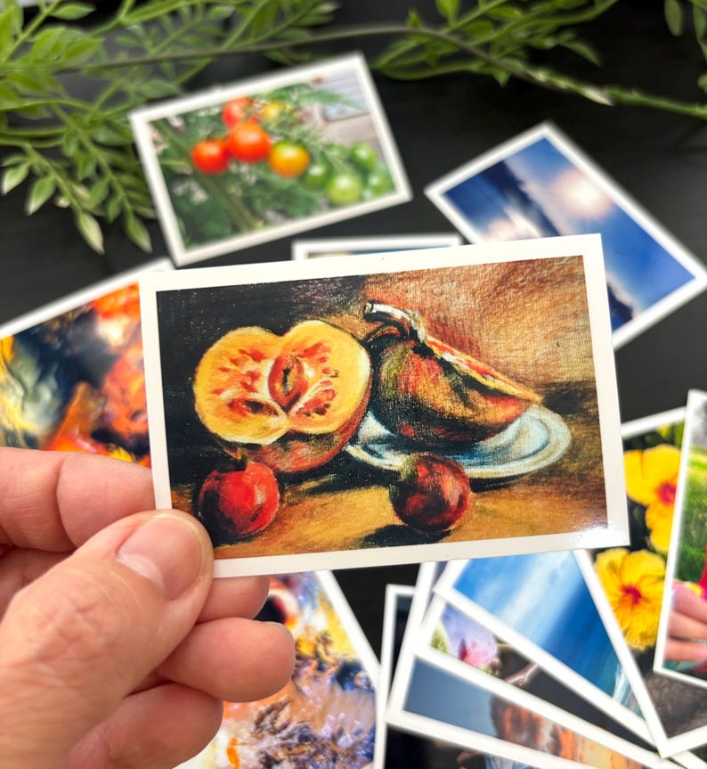 May include: A rectangular art print featuring a colored pencil drawing of a sliced yellow and orange fruit, a whole dark fruit on a small plate, and two small round red fruits arranged on a surface with a warm, textured brown background.