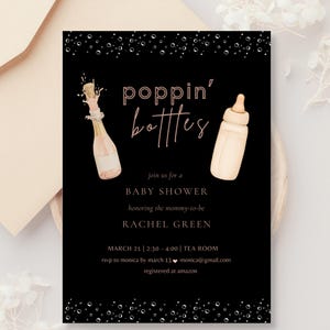 May include: Black baby shower invitation with the words "poppin' bottles" in a stylish font. The invitation includes a champagne bottle and a baby bottle illustration. Details include the date, time, location, and RSVP information.