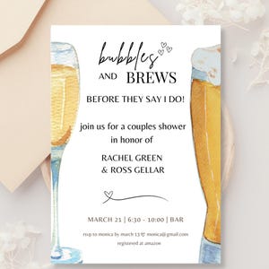 May include: A white invitation card with a watercolor illustration of a champagne flute and a beer glass. The text reads "Bubbles and Brews Before They Say I Do!"  Join us for a couples shower in honor of Rachel Green & Ross Gellar. March 21 | 6:30 - 10:00 | Bar. RSVP to Monica by March 13 monica@gmail.com. Registered at Amazon.