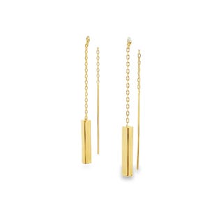 May include: A pair of gold-tone threader earrings, each featuring a delicate chain connected to a smooth, rectangular bar pendant. The design includes a straight, thin post that extends from the chain, creating a long, linear silhouette.