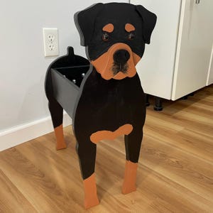 May include: A set of three ceramic mugs with a speckled, matte finish. The mugs are in shades of cream, light gray, and dark gray. Each mug has a simple, modern design and a rounded handle.