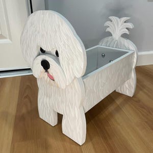 May include: A set of three ceramic mugs with a speckled, matte finish. The mugs are in shades of cream, light gray, and dark gray. Each mug has a simple, minimalist design, perfect for coffee or tea.