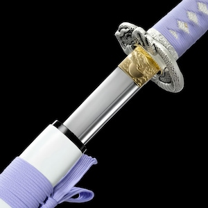 May include: Close-up of a katana sword with a polished silver blade. The hilt is wrapped in light purple fabric, and the guard features ornate silver and gold detailing. The scabbard is white with a matching purple tie, set against a black background.