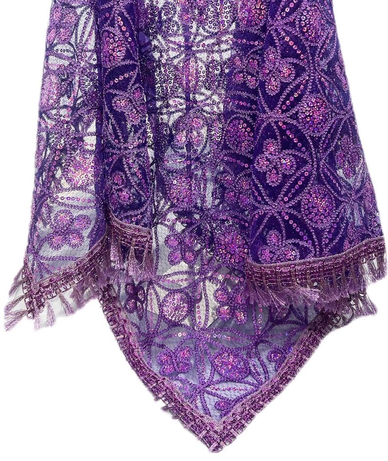 May include: A purple sequined lace fabric with a fringe border. The fabric has a floral pattern and is sheer.