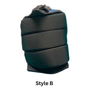 May include: Black padded wrist support with a blue logo. Style B.