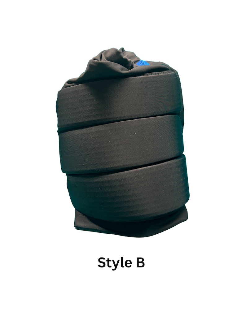 May include: Black padded wrist support with a blue logo. Style B.