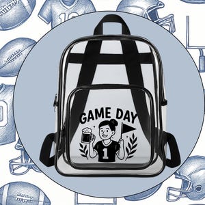 May include: Clear backpack with black trim and straps. The front pocket features the words "GAME DAY" above a graphic of a person holding a beer and a flag. The background has football-themed illustrations.