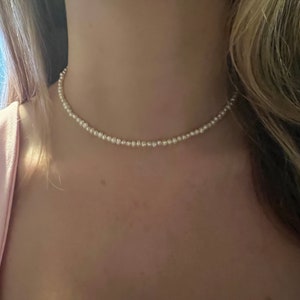 Mini Freshwater Pearl Necklace with sterling silver 18k gold plated backing. 16” plus 3” extension