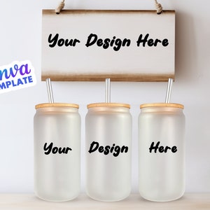May include: Three frosted glass tumblers with bamboo lids and metal straws. The tumblers are labeled "Your", "Design", and "Here". A wooden sign above the tumblers reads "Your Design Here".