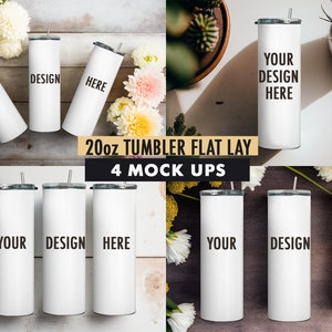 May include: Four 20-ounce stainless steel tumblers with lids and straws. The tumblers are white and have the text "YOUR DESIGN HERE" printed on them. The tumblers are arranged in a flat lay on a wooden surface with flowers.