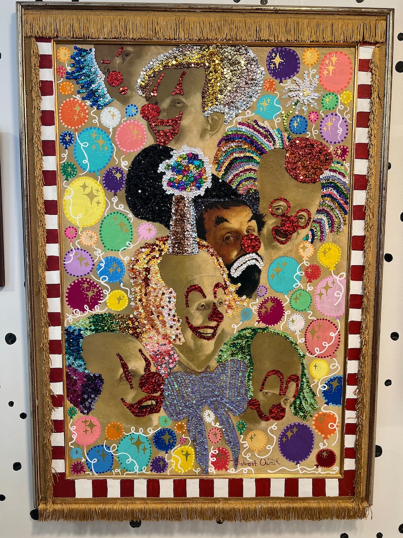 May include: A framed artwork featuring a group of clowns with colorful sequins and glitter. The background is a beige canvas with colorful circles and swirls. The artwork is signed "Robert Quiz".