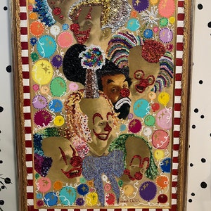 May include: A framed painting of a group of clowns with colorful sequins and glitter. The painting is set against a background of colorful circles and swirls. The painting is signed "Robert Ouimet".