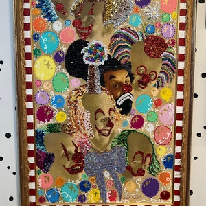 May include: A framed painting of multiple clowns with colorful sequins and glitter. The background is a red and white striped pattern with colorful circles and stars. The painting is signed "Robert Quinn".