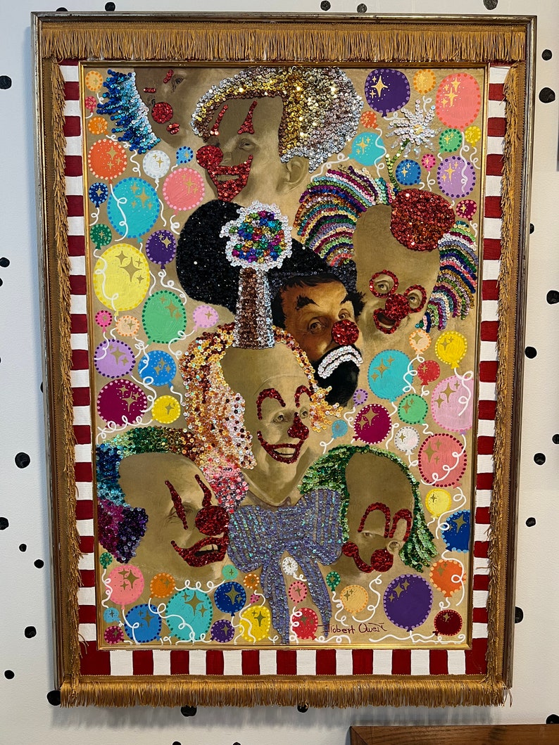 May include: A framed painting of multiple clowns with colorful sequins and glitter. The background is a red and white striped pattern with colorful circles and stars. The painting is signed "Robert Quinn".