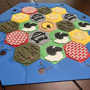 Catan edição 3D tem peças esculpidas pelo designer original do jogo -  Nerdizmo