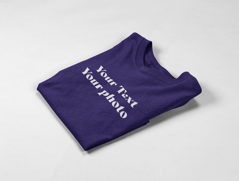 a purple t - shirt with white writing on it