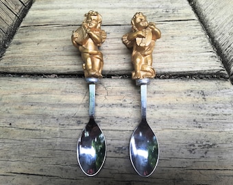 Vintage Stainless Steel Serving Spoons with Golden Cherub Handles