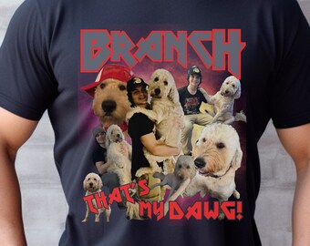 May include: A black t-shirt with a graphic of a band called "Branch" and the text "That's My Dawg!" The graphic features a group of people and dogs.